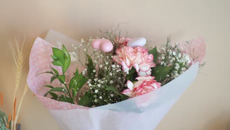 pink carnation bouquet with hearts