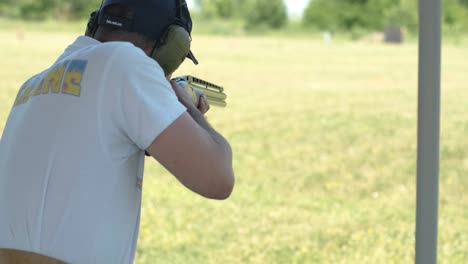 sportsman shoots from a double-barreled shotgun, a sports field for a shooting test is shooting at flying skeet