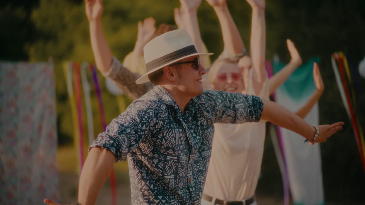 Happy man dancing against friends swaying sideways