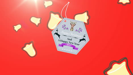 animación del texto de navidad sobre las campanas de navidad que caen sobre un fondo rojo