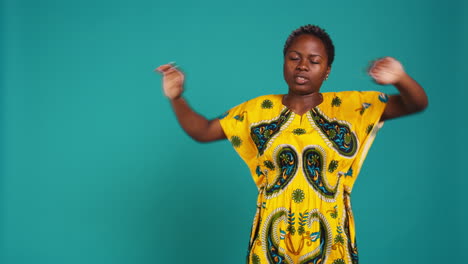 Natural-sweet-woman-stretching-her-back-and-arms-muscles-in-studio