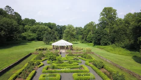 Magical-white-wedding-gazebo-surrounded-by-nature-and-symmetrical-park