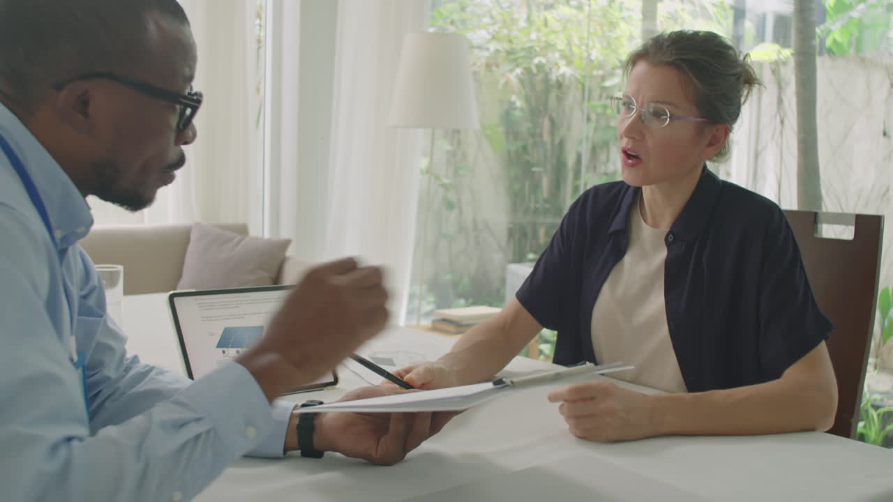 Multi-Ethnic Business Partners Discussing Green Energy Contract