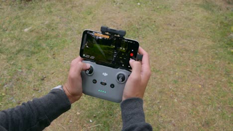 Controlling drone flight with smartphone and remote controller