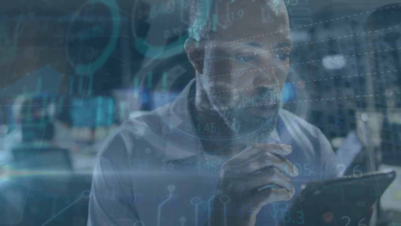 Animation of data processing over businessman using tablet in office