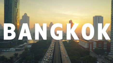 drohnenaufnahme der skyline der thailändischen stadt bei sonnenuntergang, überlagert mit einer animierten grafik, die bangkok buchstabiert