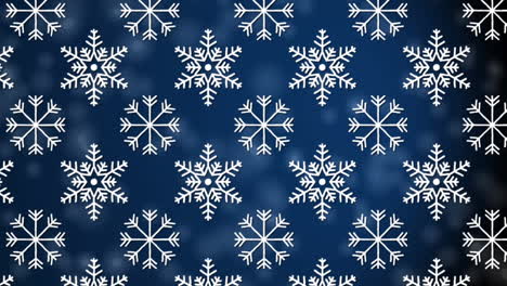 digital animation of snowflakes icons in seamless pattern against spots of light on blue background