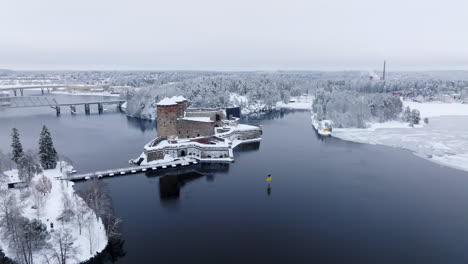 panoramic drone shot around the olavinlinna castle, winter in savonlinna, finland