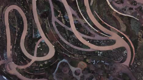 4k overhead drone shot of botanical garden with unique windy trails