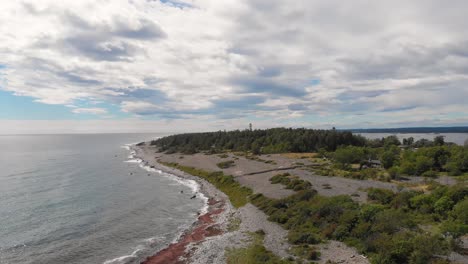 aerial: jomfruland coastline, remote norwegian island wilderness, sliding view