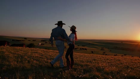 couple enjoying a sunset on the ranch