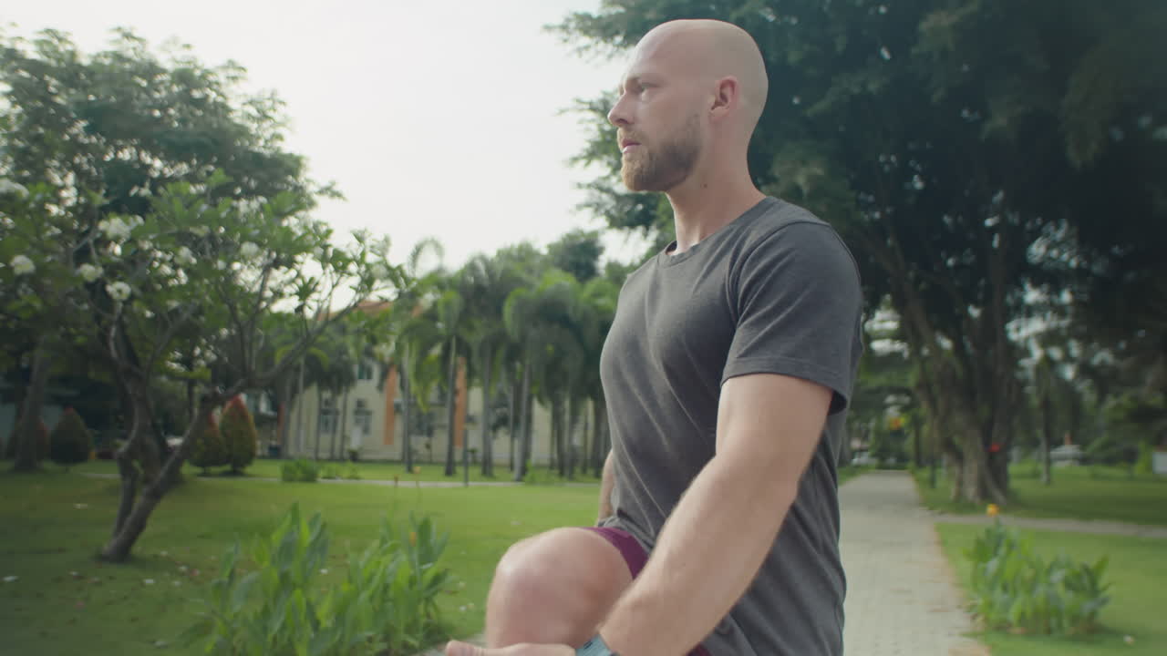 Sportive Man Stretching in Park