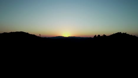 beautiful sunset filmed with drone in the middle of nature with mountain in the background and beautiful landscape