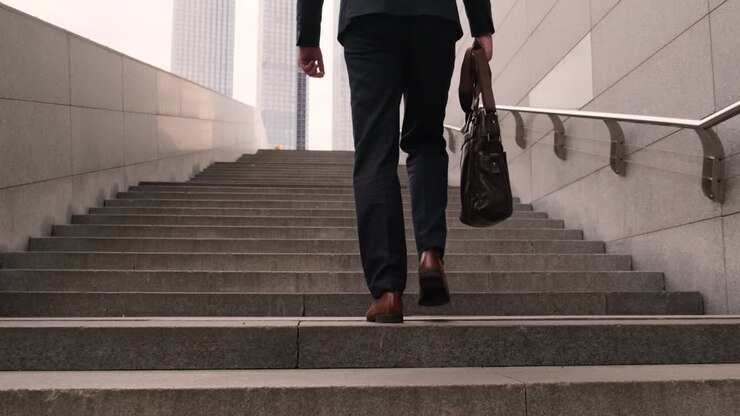 The working man holding business handbag with office formal suit walking outdoor