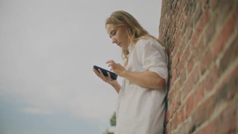 woman texting on smartphone