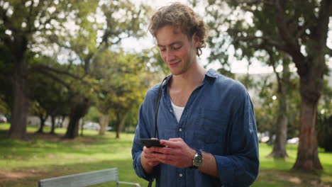 man using smartphone in the park