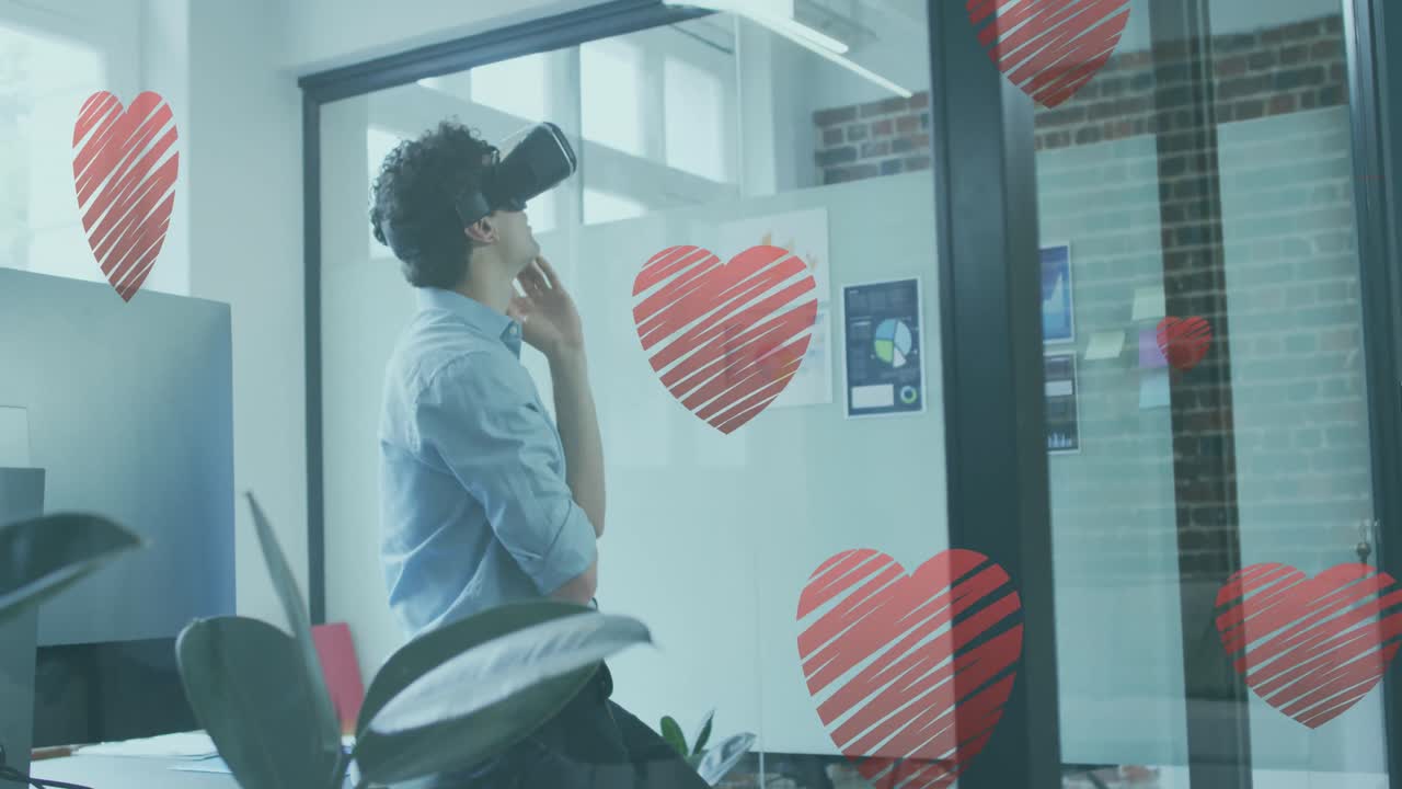 несколько икон красного сердца падают над кавказским носящим vr наушники в офисе