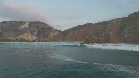 Remote-sand-beach-on-Atlantic-secluded-beach-surrounded-by-cliffs