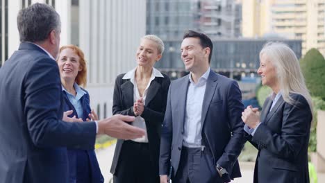 business professionals networking and collaborating outdoors