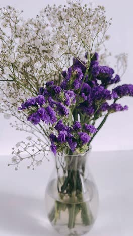 purple and white flowers in a vase