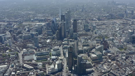 high dolly forward drone shot over central london skyscrapers