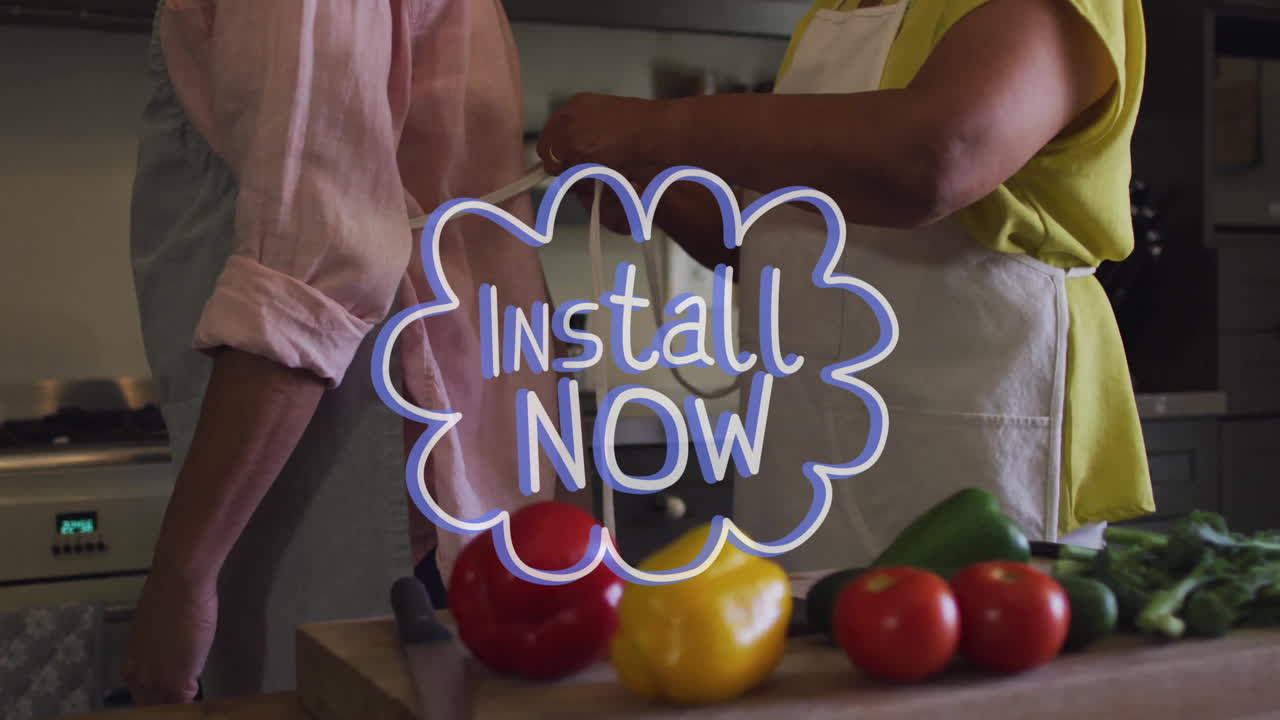 Install Now text animation over people preparing vegetables in kitchen