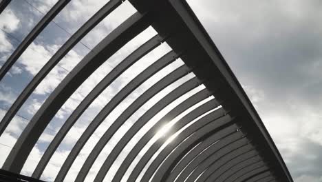 undulate wave structure at the henderson waves in singapore against bright cloudy sky - wide shot