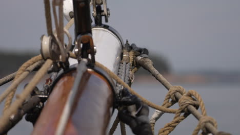 ropes and rigging on the bow of a sailboat