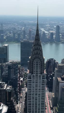 Aerial View of NYC Highlighting Iconic Landmarks Like the Chrysler. Aerial exploration of New York City highlights iconic landmarks, especially the Chrysler Building, showcasing its stunning skyline and urban life