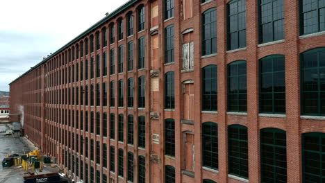 brick building exterior of riverwalk lawrence from merrimack street in lawrence, massachusetts, usa