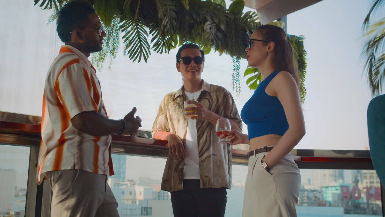 Diverse Friends Chilling with Drinks at Trendy Bar with Panoramic Windows