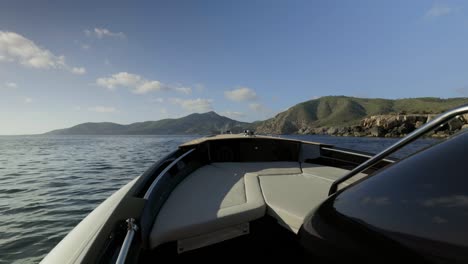 riding on a boat on coast of island