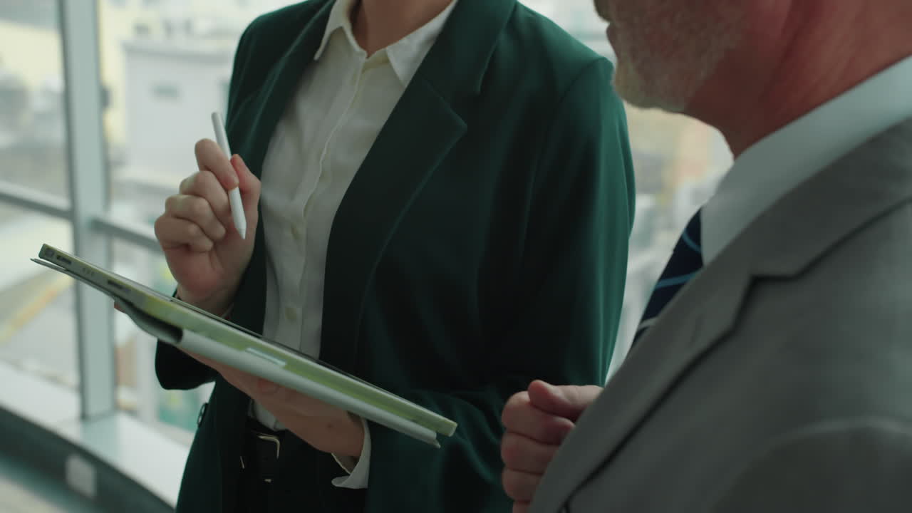 Assistant Agreeing Terms of Contract with Businessman