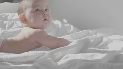 cute happy baby smiling in bed