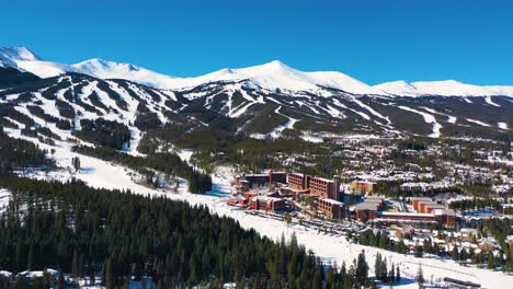 ski resort with slopes and trails on top of beautiful mountains covered in white powder snow