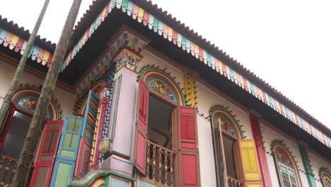 colorful window shutters and architecture on tan teng niah old traditional chinese trading house in the little india neighborhood of downtown singapore in asia