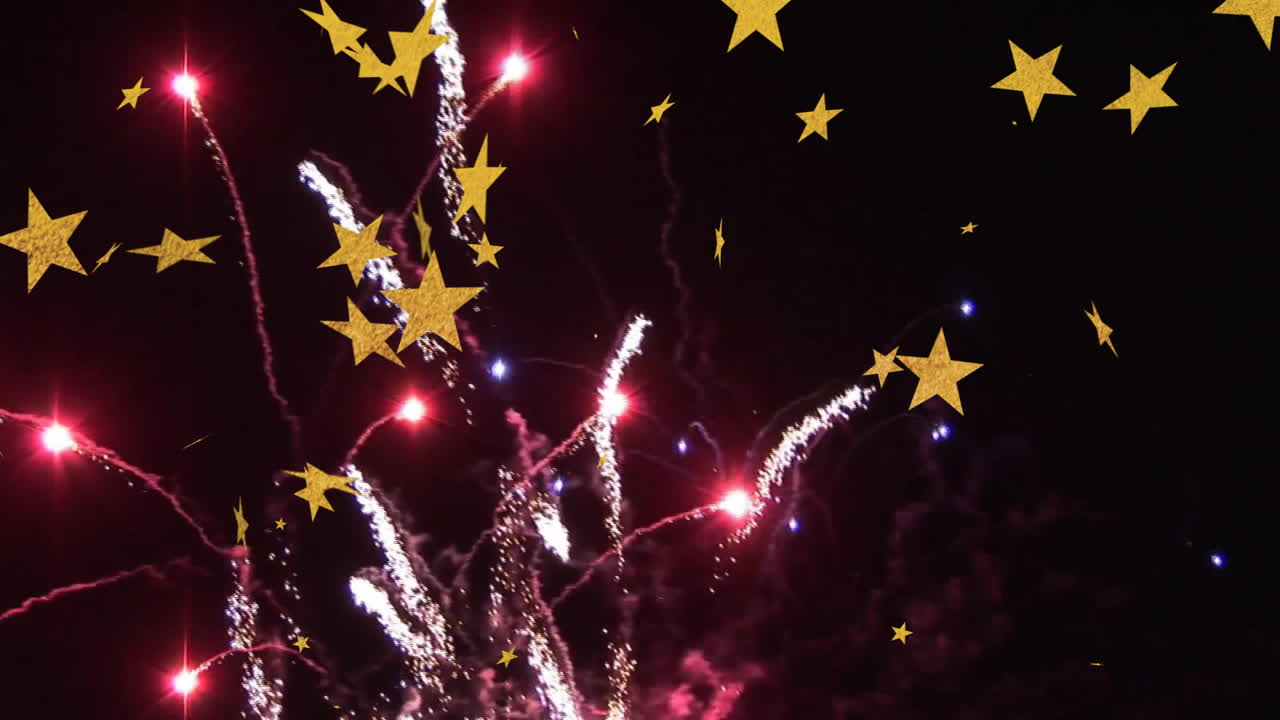 Fireworks display with yellow stars animating over dark night sky