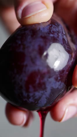 squeezing a plum
