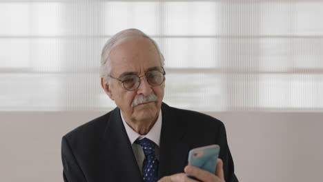 portrait of middle aged businessman executive texting browsing using smartphone networking online mobile communication