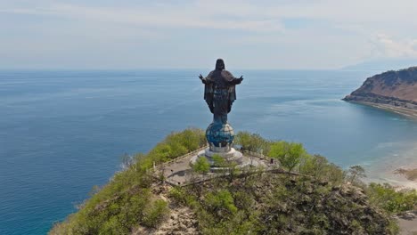 cristo rei of dili statue in east timor - aerial drone shot