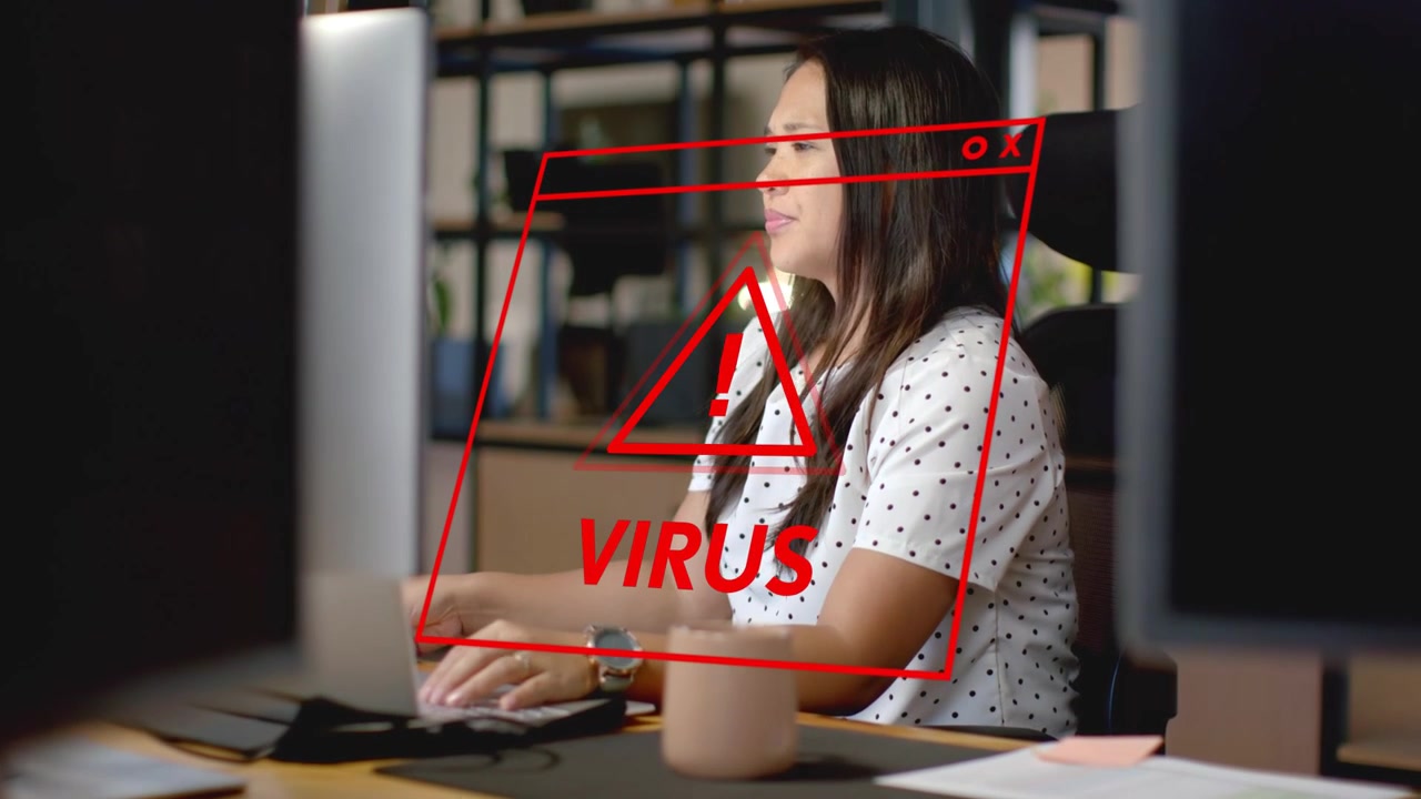 Office worker reacting to red VIRUS warning overlaying screen, adjusting glasses, checking security