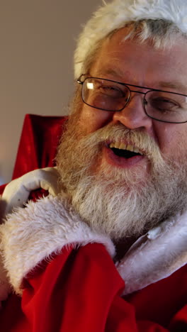 portrait of santa claus carrying sack with present