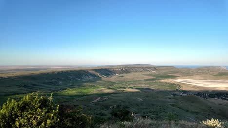 A-stunning-view-of-a-valley-in-Crimea-with-a-blue-sky-and-green-hills