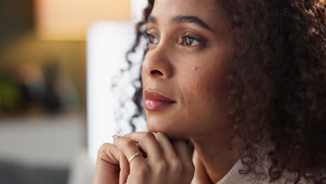 a woman with curly hair is thinking and looking contemplative