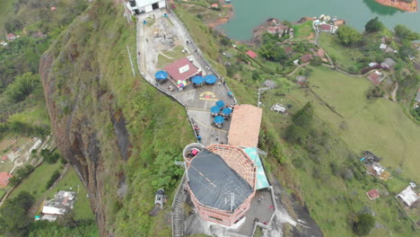 top view of el peã±ã³n de guatapã© - the rock of guatape in antioquia, colombia - aerial drone shot