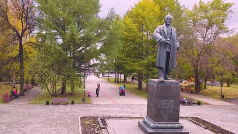 lenin monument in a park during autumn