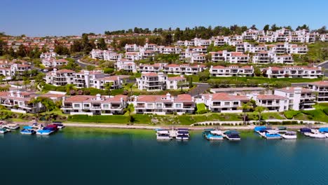 aerial fly by of condos on community lake mission viejo