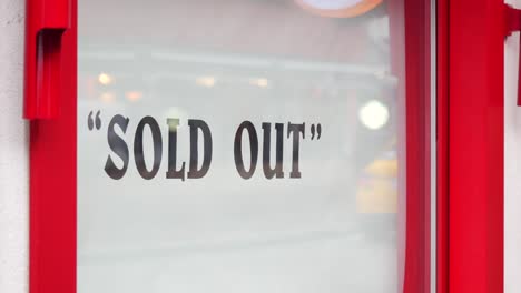 sold out sign on a store window