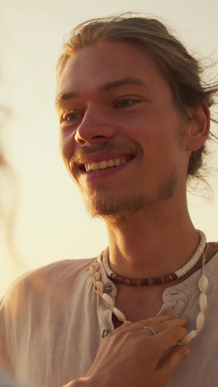 Smiling Man with Seashell Necklace