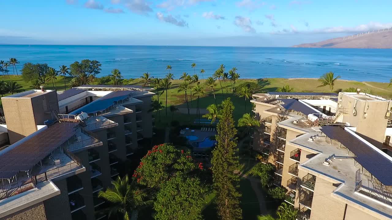 Idyllic holiday resorts for summer vacations on shoreline of beautiful Hawaiian island surrounded by deep blue ocean